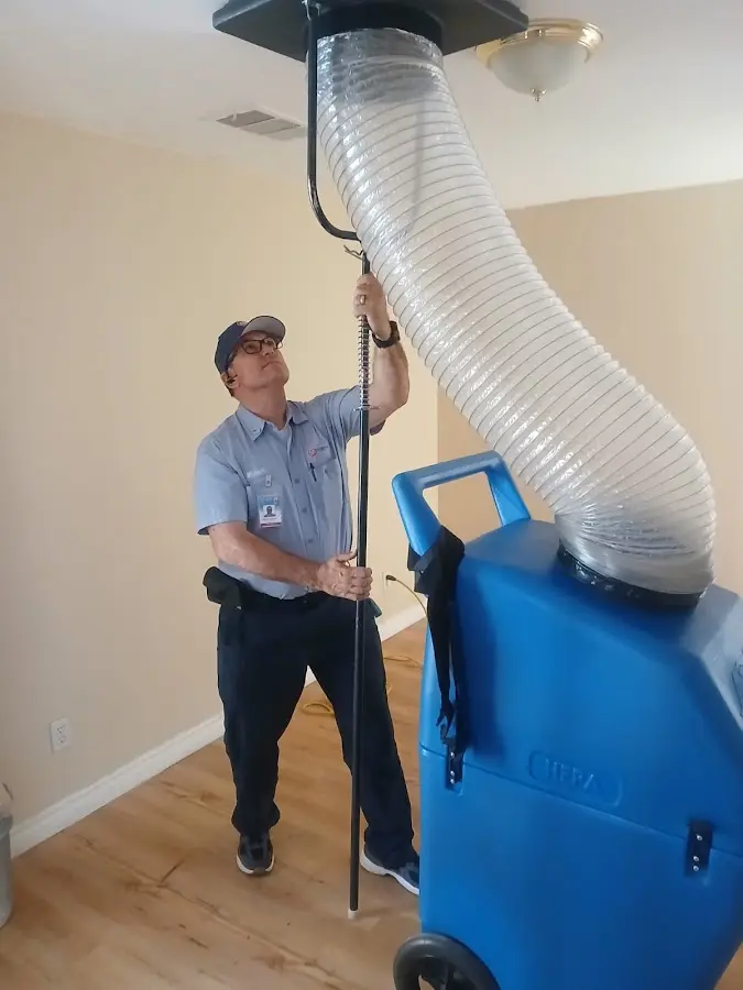 Furnace Tune-Up technician using HEPA equipment in Sulphur Springs